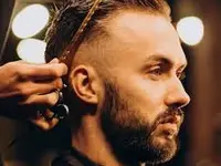Adam Barbershop Coiffeur, Inhaber Khaled