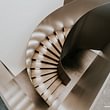 AMM - Geschwungene Treppe mit Stahl und Design