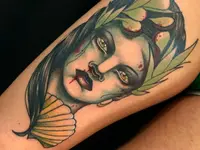 Raketenwacholder Tattoo und Piercing